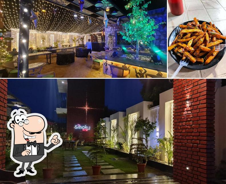 Take a look at the image showing interior and food at The Smoky Grill