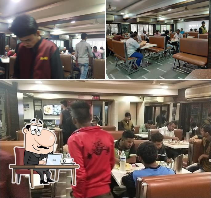 Take a seat at one of the tables at Hotel Rolex