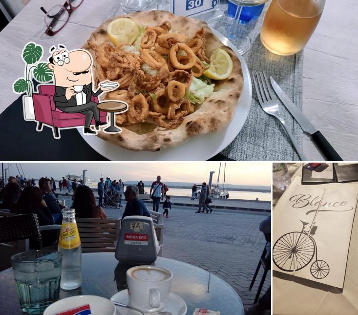 Dai un'occhiata agli interni di Blanco Pizzeria
