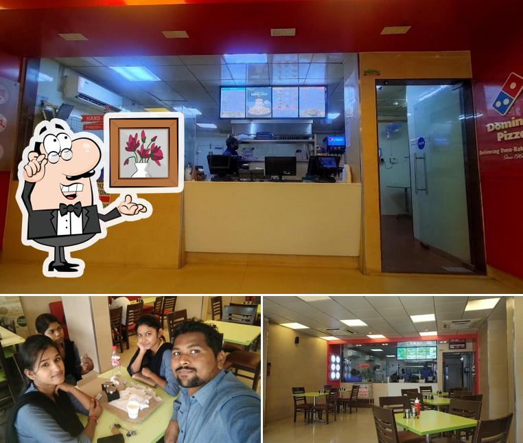 Take a seat at one of the tables at Domino's Pizza Civil Lines, Chandrapur