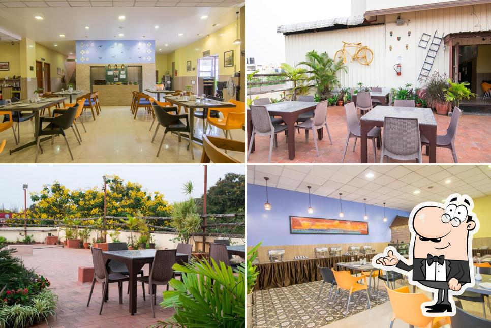 Take a seat at one of the tables at CLAY RESTO @Bangalore Gate Hotel