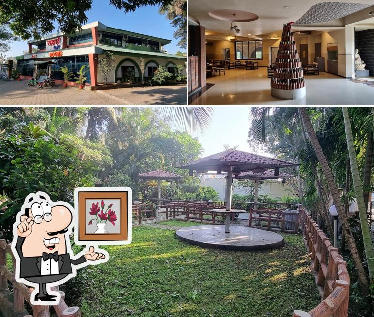 Take a seat at one of the tables at Sahyadri Hotel