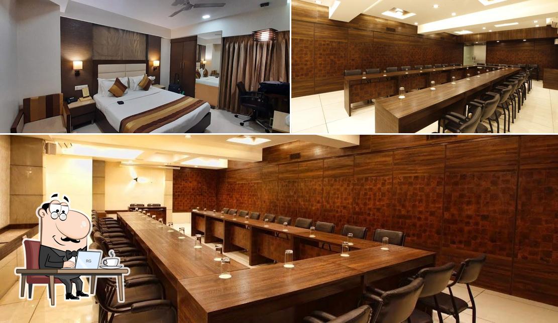 Take a seat at one of the tables at Hotel Le Grande Residency