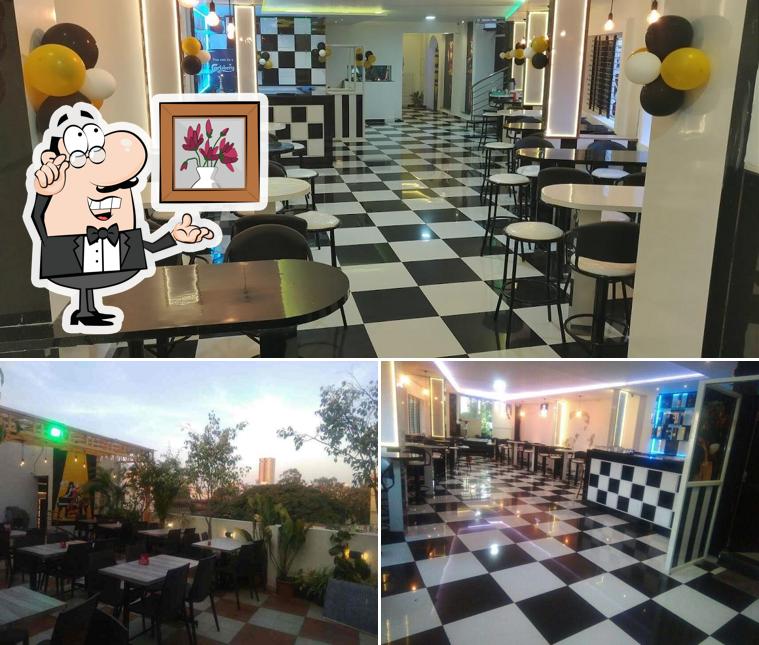 Take a seat at one of the tables at 3Page Multicuisine Restaurant & Bar