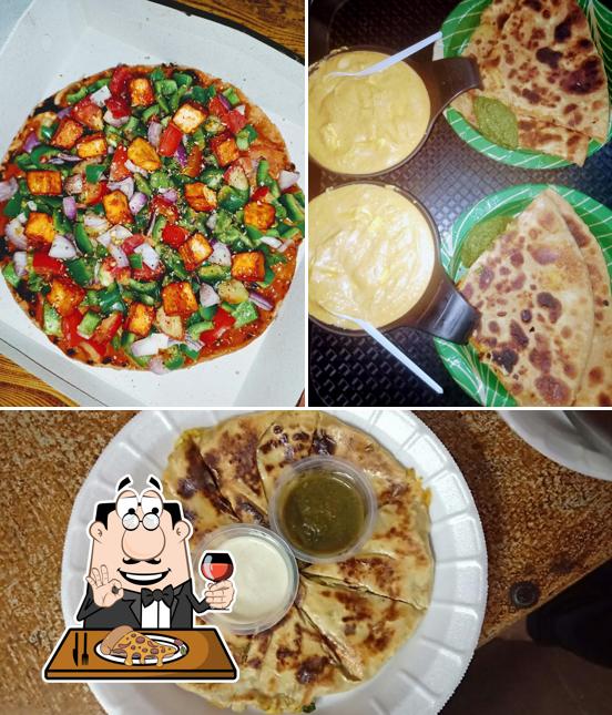 Try out pizza at Nashta Cafe
