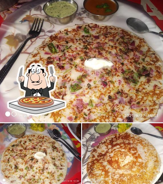 Try out pizza at Pruthvi Nashta Centre