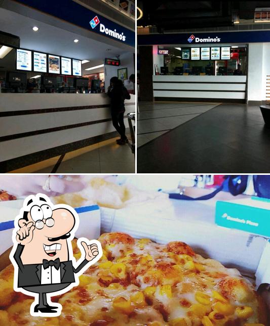 Check out the image showing interior and pizza at Domino's Pizza Hazratganj, Lucknow