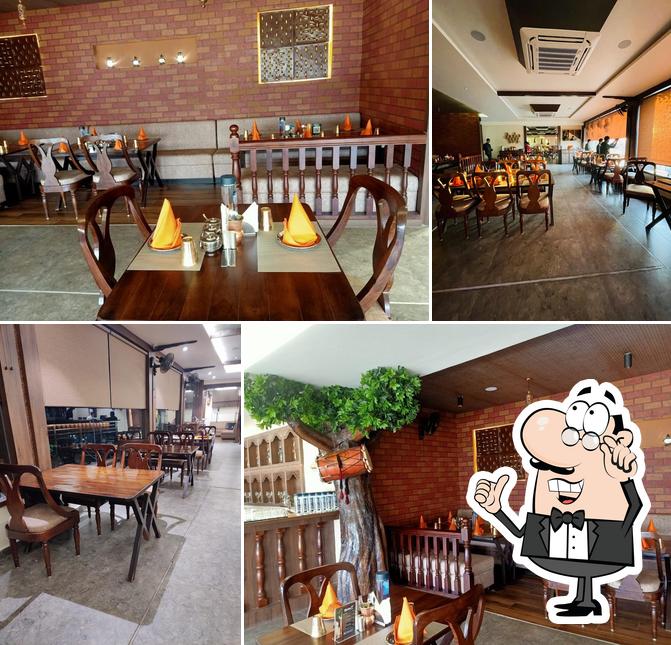 Take a seat at one of the tables at Pind Balluchi