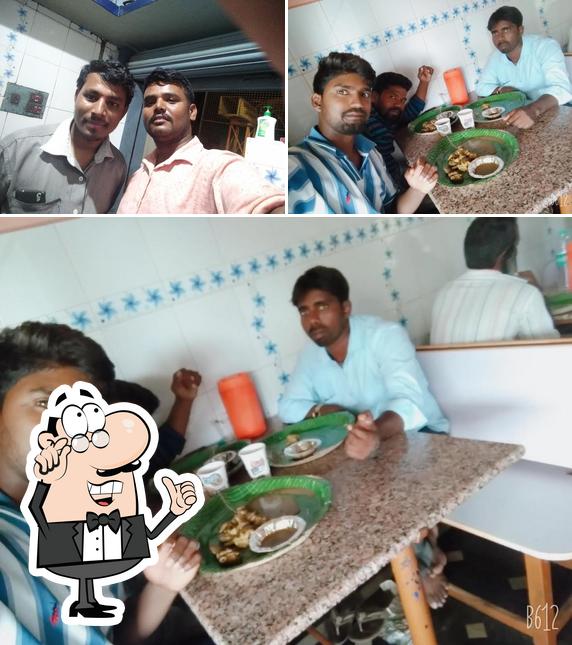 This is the photo depicting interior and dining table at Ravi Pork Hotel