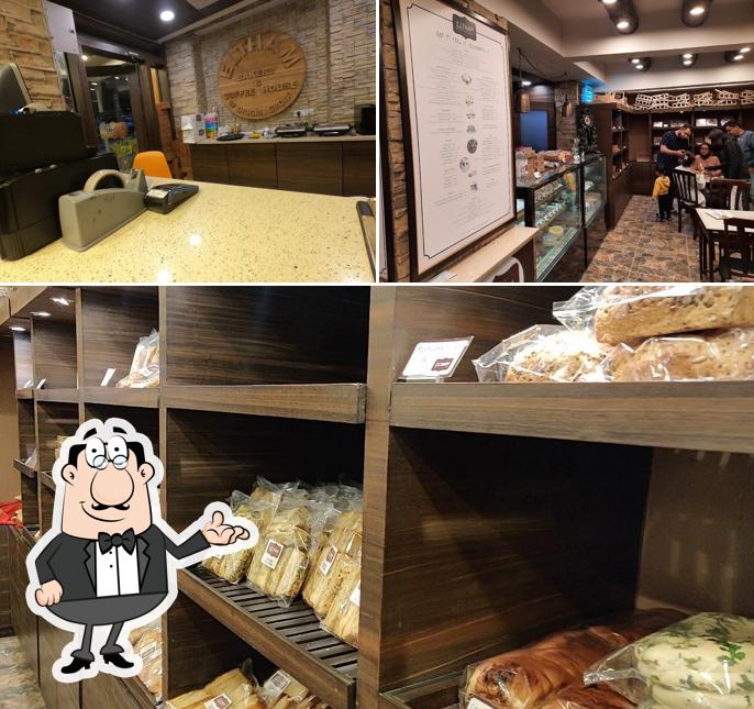 Take a seat at one of the tables at ELTHAM Bakery and Coffee House - Best Coffee Shop in Dehradun Best Bakery Shops in Dehradun