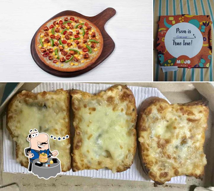 The photo of MOJO Pizza - 2X Toppings’s food and interior