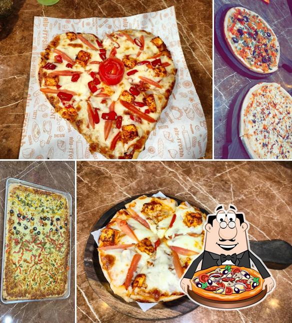 Get pizza at The Pizza Dine (Kasindra)