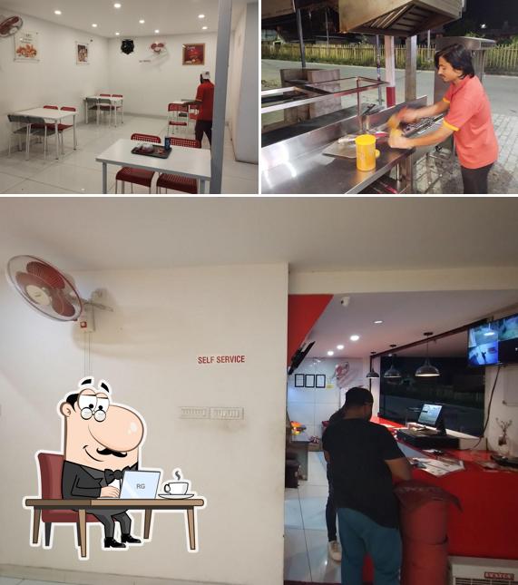 This is the image showing interior and beverage at The Afc restaurant magadi