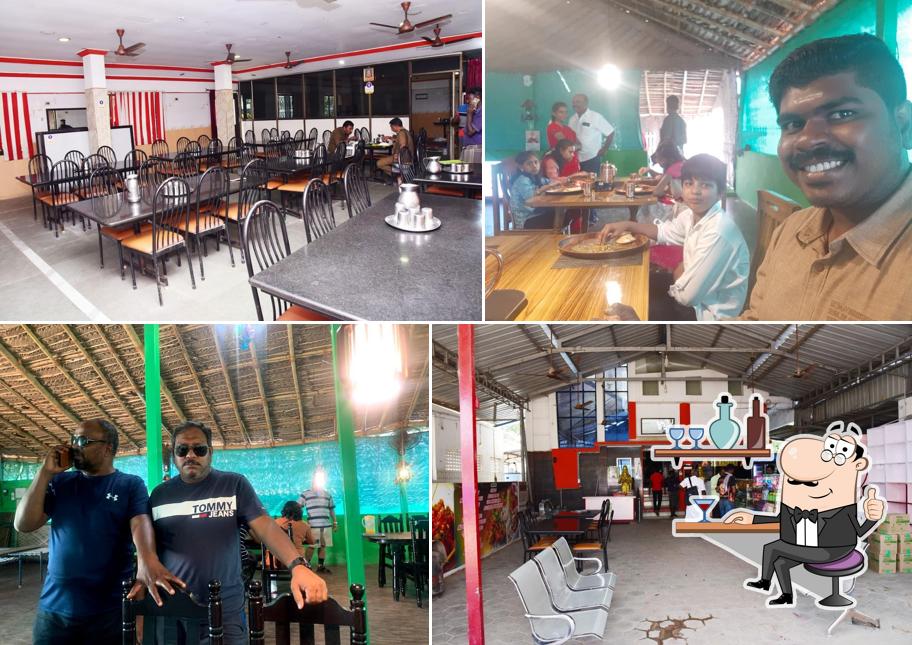 Take a seat at one of the tables at Sri Madhura High class non Vegetarian