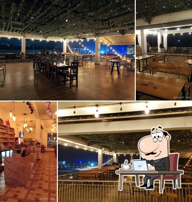 Take a seat at one of the tables at JOMO - Cafe and Restaurant