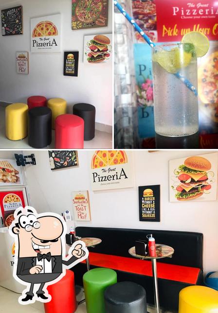 This is the picture depicting interior and beverage at The great PizzeriA