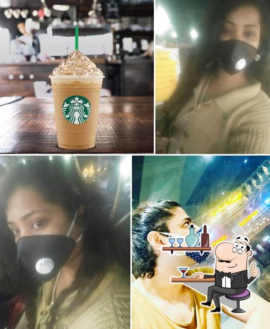 Take a seat at one of the tables at Starbucks