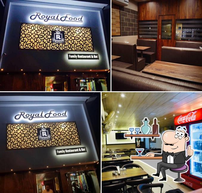 Take a seat at one of the tables at Royal Food Family Restaurant & Bar