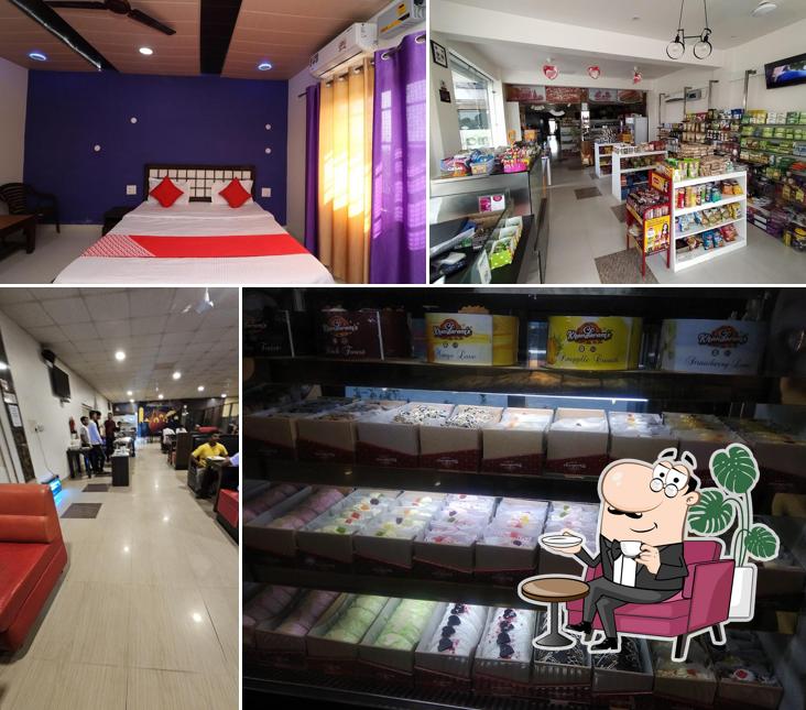 Take a seat at one of the tables at Mango Hotel, Bakery, Restaurant