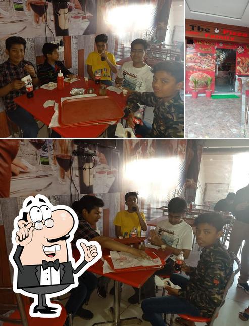 The picture of interior and food at The pizza famil