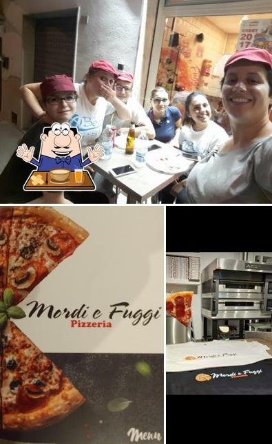 Guarda la foto che mostra la cibo e interni di Mordi e Fuggi