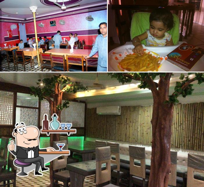 Take a seat at one of the tables at The Savera Hotel & Restaurant