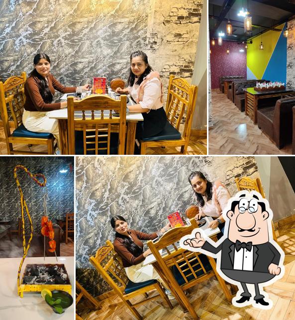 Take a seat at one of the tables at GOLDEN TASTE MULTI CUISINE FAMILY RESTAURANT