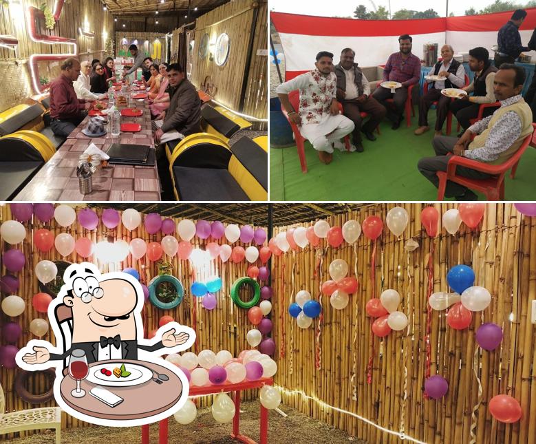 The picture of dining table and interior at AAOJI KHAOJI RESTAURANT Veg and Nonveg