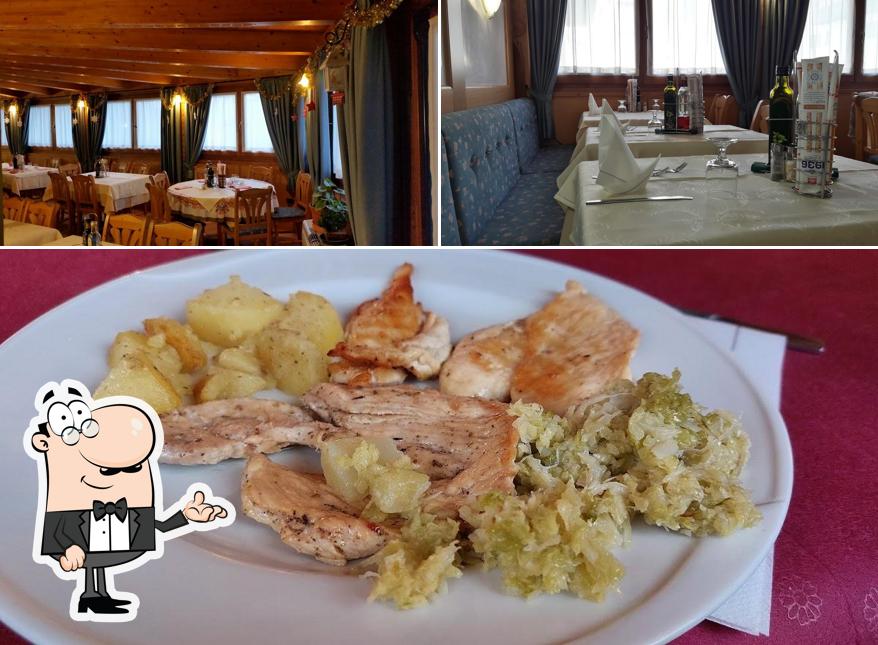 La immagine di interni e cibo da Antica Trattoria Bar Alla Stazione