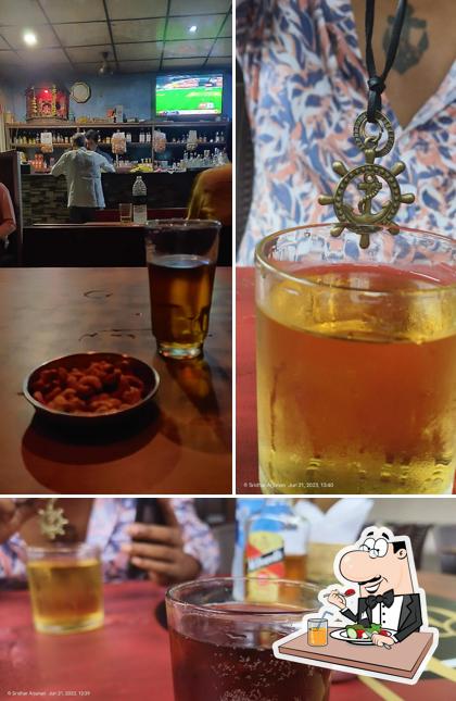 Take a look at the picture depicting food and bar counter at Roshini Bar & Restaurant