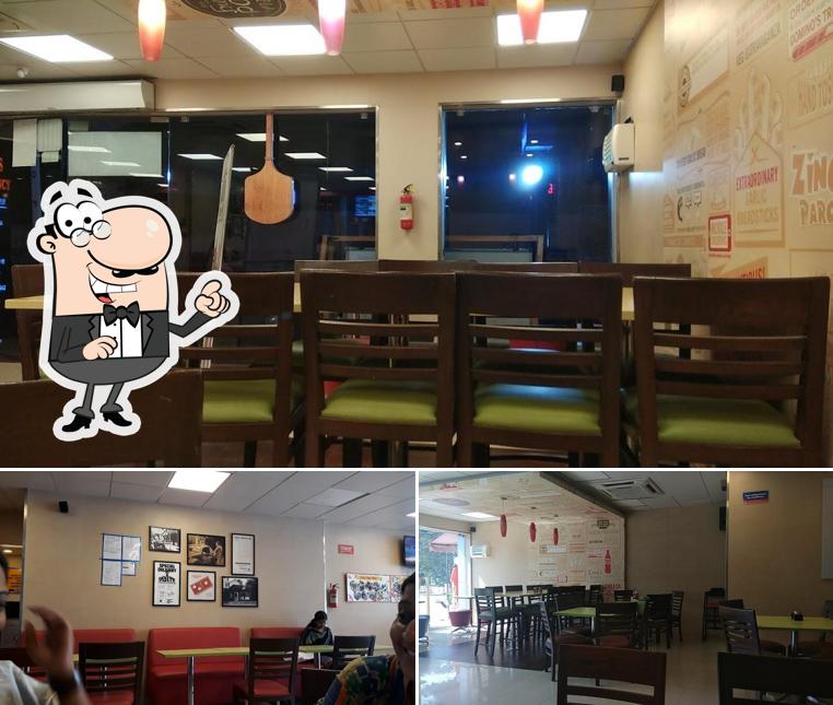 Take a seat at one of the tables at Domino's Pizza Vinayaka colony, Palakkad Take a seat at one of the tables at Domino's Pizza Vinayaka colony, Palakkad