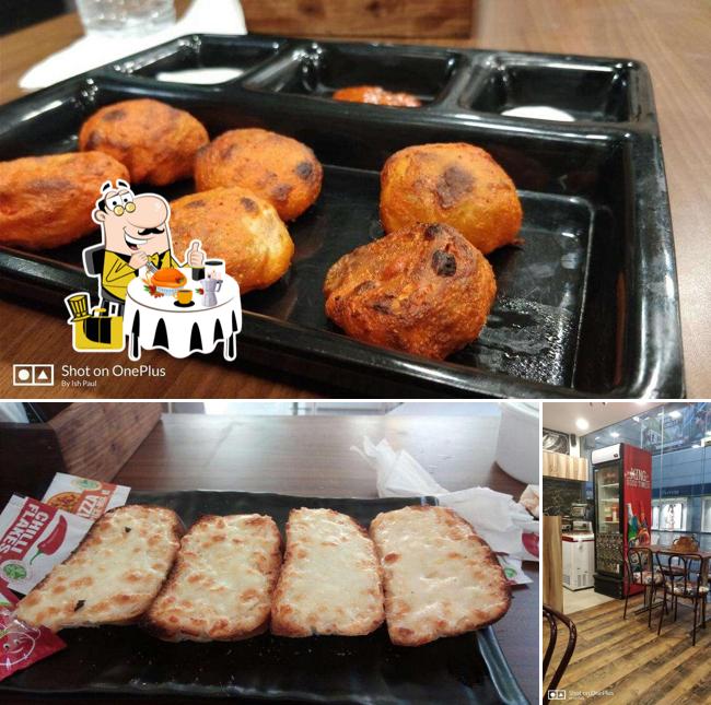 Take a look at the photo showing food and interior at Cafe Munchbox 2.0