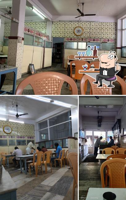 Take a seat at one of the tables at Padma Cafe(Veg)