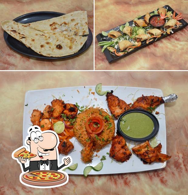 Try out pizza at R.R Hotel Bar Non Veg Restaurant and take away pushkar