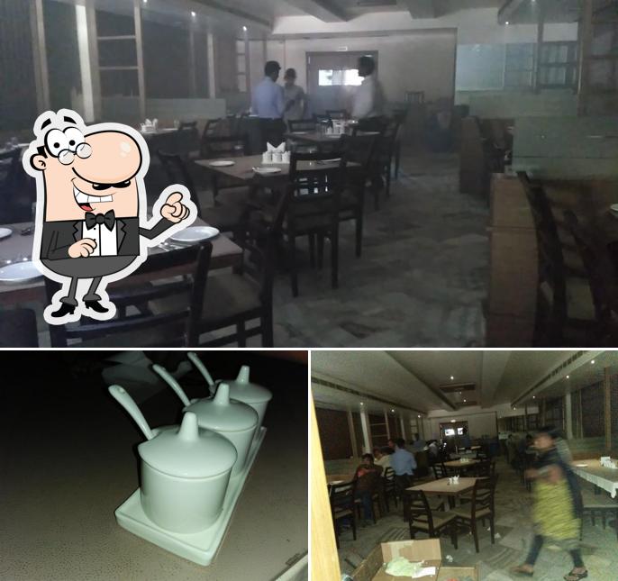 Take a seat at one of the tables at Green Tree Restaurant