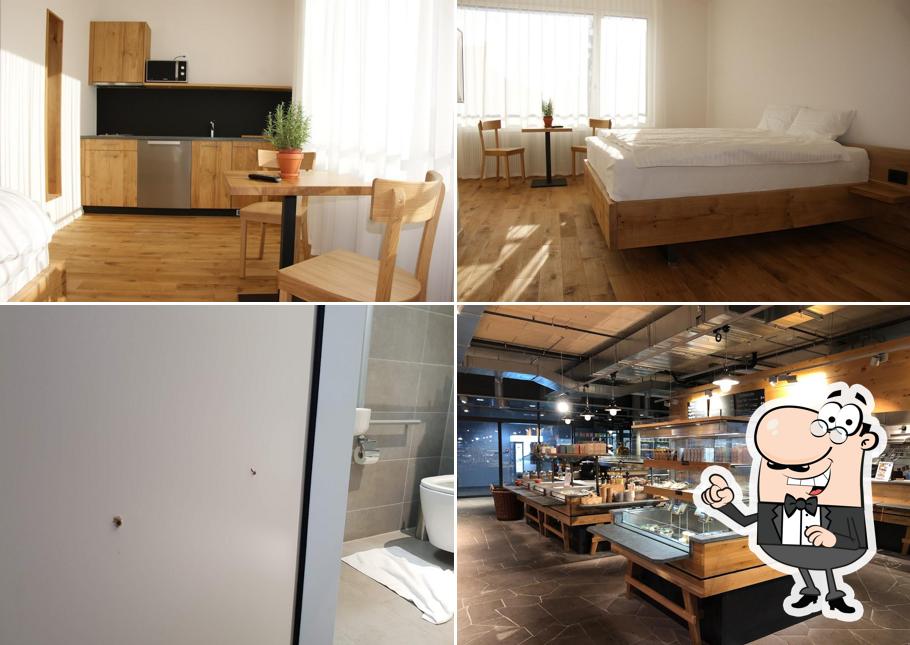 Siediti a un tavolo di LOCAL Hotel - Apartments, Markt, Restaurant und Store - Suhr