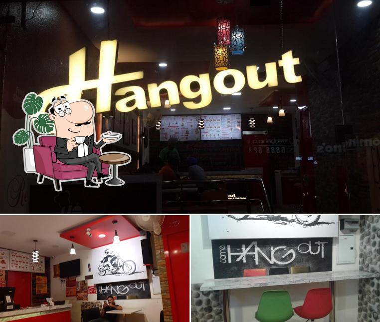 Take a seat at one of the tables at Hangout Pizza & Fried Chicken