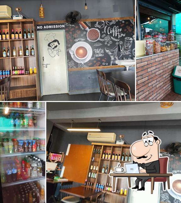 Take a seat at one of the tables at JJ CAFE & DHABA
