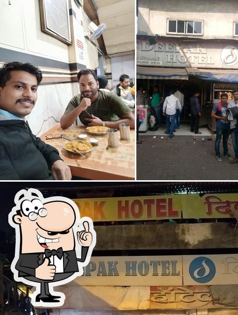 Look at this photo of Deepak Hotel