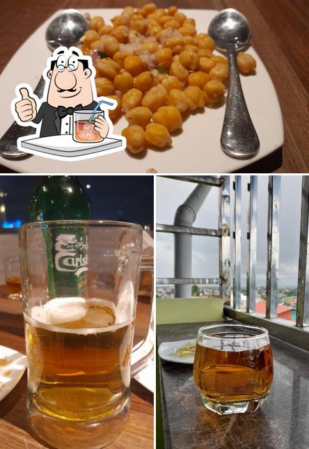 Among various things one can find drink and food at Madira Rooftop Bar Cum Restaurant