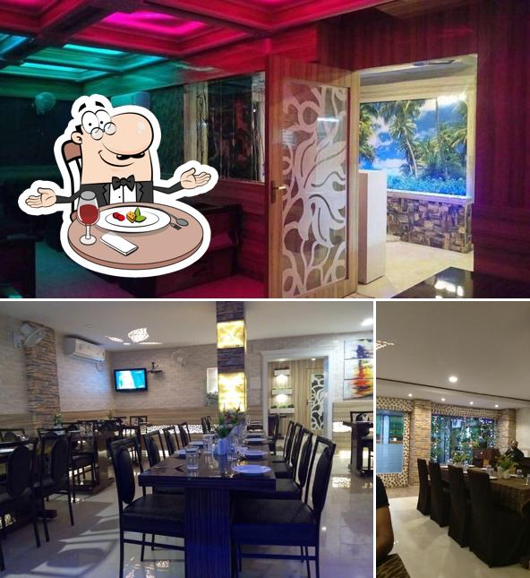 The picture of dining table and interior at The Treat