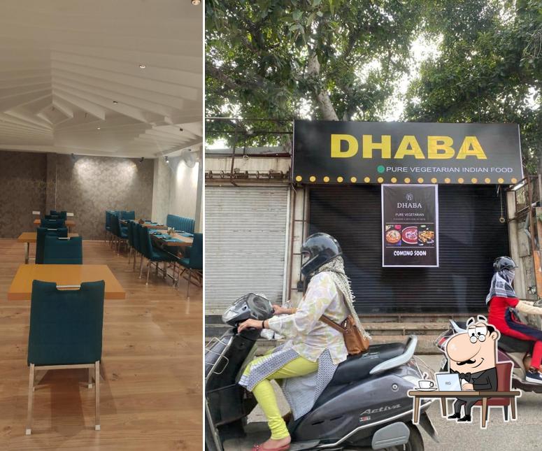 Take a seat at one of the tables at Dhaba