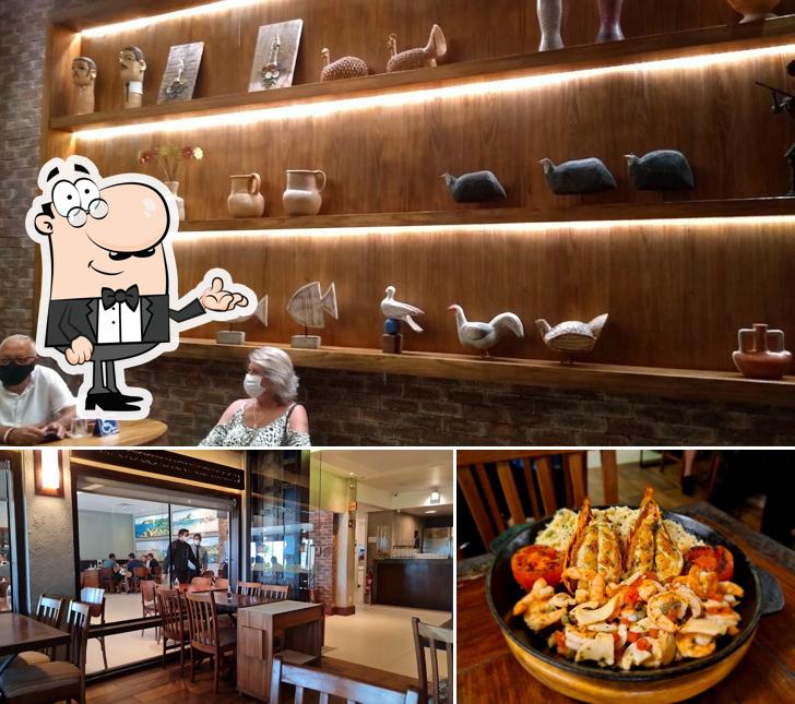 Sente em uma das mesas no Camarões Restaurante
