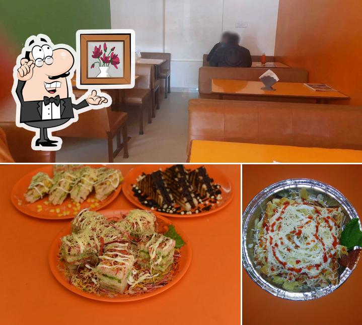 Take a seat at one of the tables at INDIAN SANDWICH AND PAV BHAJI
