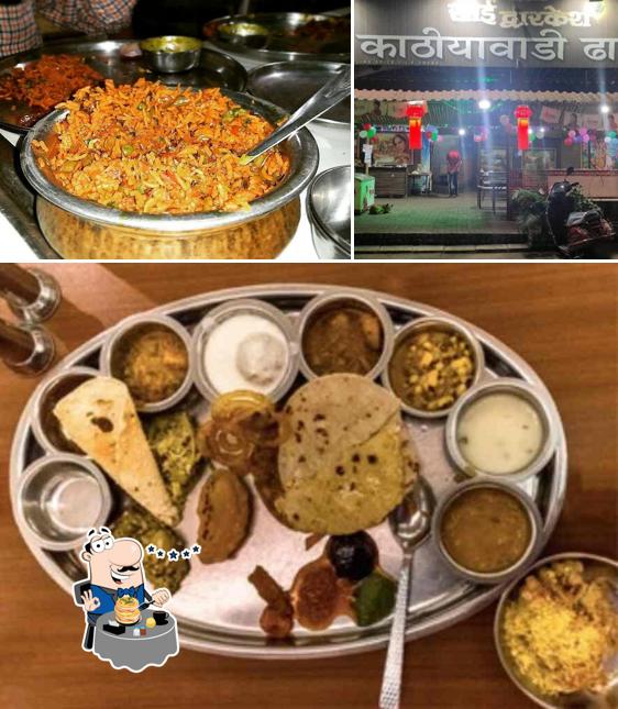 The photo of food and exterior at Sai Dwarkesh Kathiyawadi Dhaba