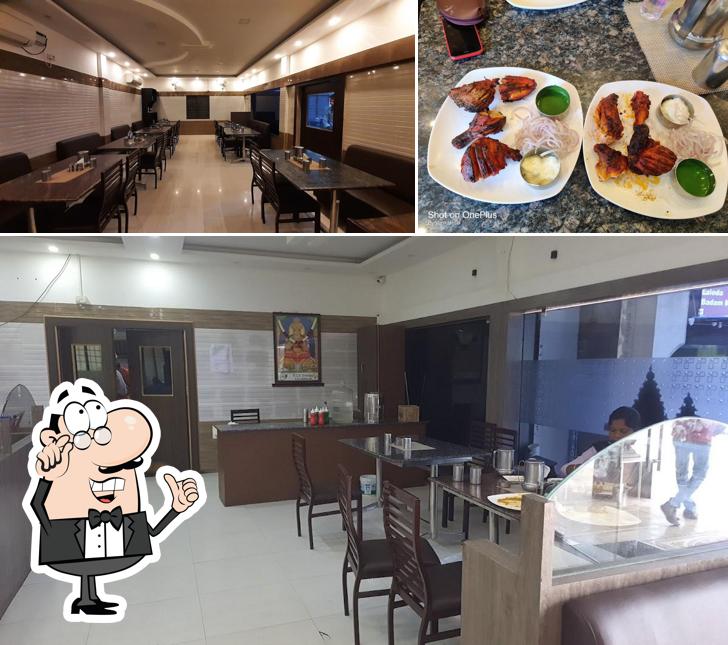 Take a seat at one of the tables at Karikalan A/C Family Restaurant (Veg & Non Veg)