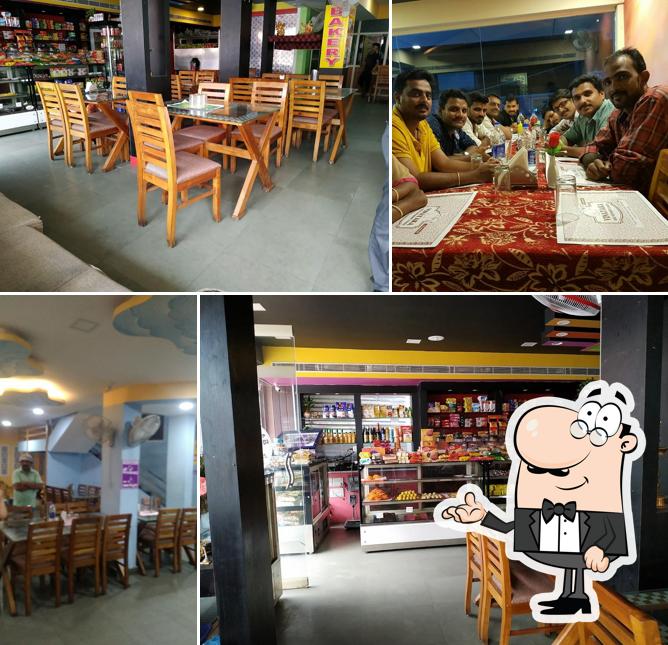 Take a seat at one of the tables at Vinayaka Bakery & Restaurant