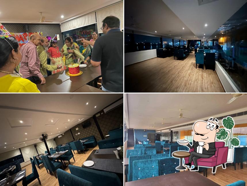 Take a seat at one of the tables at Bluemoon Elite Sports Bar and Family Restaurant