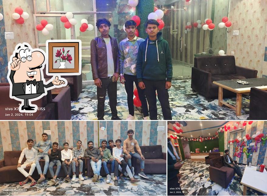 Take a seat at one of the tables at Pizza Point And Bekry Shop