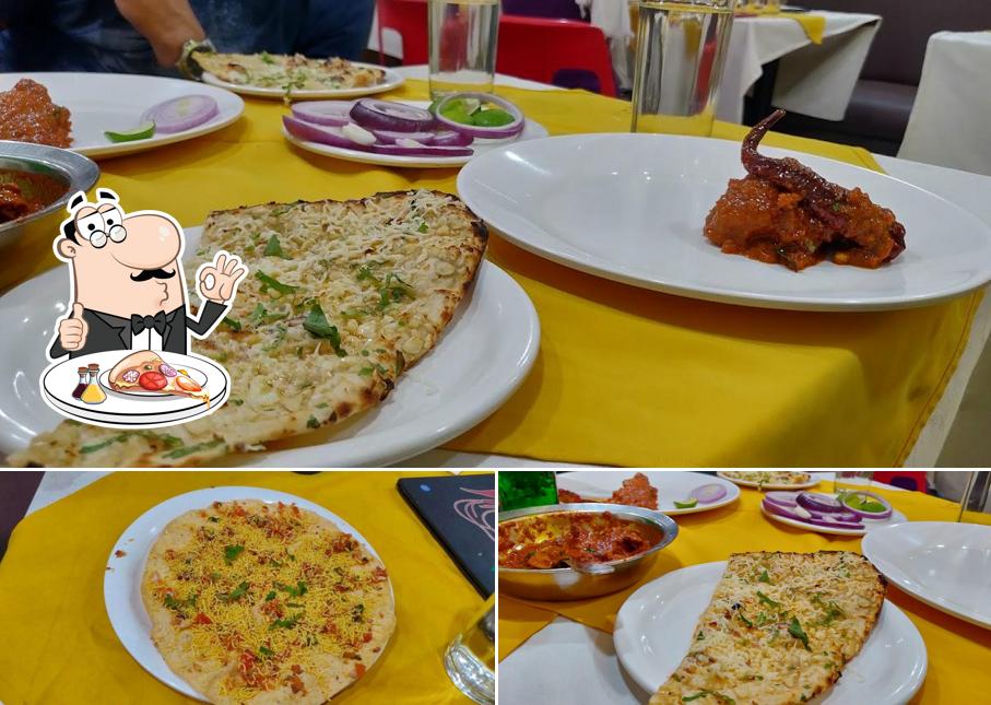 Pick pizza at Hotel amchi Restaurant and bar